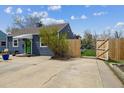 Side yard showing a gate to the backyard and the home's exterior at 1995 Xenia St, Denver, CO 80220