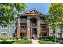 Attractive multi-level condo building featuring balconies, brick accents, and well-maintained landscaping at 804 Summer Hawk Dr # 3202, Longmont, CO 80504