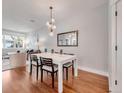 A dining room with modern light fixture at 1140 S Sherman St, Denver, CO 80210