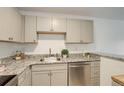 A kitchen with stainless steel appliances, granite countertops, light gray cabinets, and breakfast bar at 5120 Williams Fork Trl # 210, Boulder, CO 80301
