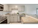 An eat-in kitchen area featuring stainless steel appliances, granite countertops, and an island at 5120 Williams Fork Trl # 210, Boulder, CO 80301