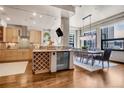 Light wood kitchen cabinets, granite counters, and stainless steel appliances at 1800 Lawrence St # 505, Denver, CO 80202