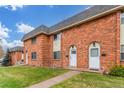 A townhome community with brick exteriors and green lawns at 3667 W Union Ave # 2E, Denver, CO 80236