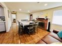 Inviting dining room with hardwood floors and a charming fireplace, perfect for Gathering gatherings at 2543 Westchester Dr, Denver, CO 80221