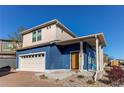 Charming two-story home with a two-car garage and inviting front porch at 19149 E 55Th Ave, Denver, CO 80249
