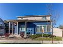 Beautiful home exterior with a covered porch and manicured front lawn in a well-kept neighborhood at 19149 E 55Th Ave, Denver, CO 80249