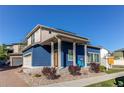 Inviting home with a charming front porch, two car garage and a well maintained landscape at 19149 E 55Th Ave, Denver, CO 80249