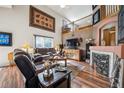 Spacious living room features vaulted ceilings, fireplace, and comfortable seating at 4814 Kingbird Dr, Frederick, CO 80504