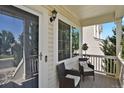 Inviting front porch with seating, perfect for enjoying a quiet morning or evening at 20356 Willowbend Ln, Parker, CO 80138
