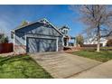 Two-story house with attached garage and driveway at 11673 Josephine St, Thornton, CO 80233