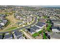 Neighborhood featuring numerous houses and green spaces at 26994 E Indore Ave, Aurora, CO 80016