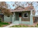 Charming single story home featuring a cozy front porch and walkway at 2664 Dahlia St, Denver, CO 80207