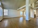 Spacious, naturally lit living room boasts beautiful wood floors and a contemporary design at 9668 Salem Ct, Highlands Ranch, CO 80130