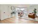 Inviting living room with ample natural light, hardwood floors, and stylish modern furniture at 3780 Benton St, Wheat Ridge, CO 80212