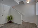 Bright entryway with wood-look tile flooring and staircase access at 9520 Halstead, Lone Tree, CO 80124