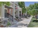 Close-up of a townhome exterior showing well-manicured landscaping at 9520 Halstead, Lone Tree, CO 80124