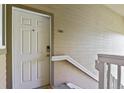 Exterior shot of the front door showing digital lock and unit number 13-203 at 8481 W Union Ave # 13203, Denver, CO 80123