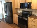 Kitchen featuring stainless steel appliances and light wood cabinets at 9088 W 88Th Cir, Westminster, CO 80021