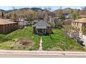 Cozy brick bungalow with a small front porch and green lawn in a residential neighborhood at 1914 Washington Ave, Golden, CO 80401