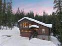 Charming mountain home with snow-covered roof and beautiful wooded surroundings at 493 Cr 672, Breckenridge, CO 80424