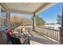 Spacious covered porch with seating area, perfect for relaxing at 7260 Fallon Cir, Castle Rock, CO 80104