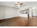 Spacious living room area with hardwood floors and an open floor plan that flows into the kitchen at 795 S Alton Way # 5D, Denver, CO 80247