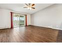 This living room has stunning hardwood floors and ample natural light from sliding glass doors to a balcony at 795 S Alton Way # 5D, Denver, CO 80247