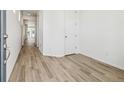 Bright and airy entryway with light wood-look flooring at 6575 N Nepal St, Aurora, CO 80019