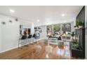 Bright and airy living room featuring hardwood floors and a modern fireplace at 383 S Vaughn Way, Aurora, CO 80012