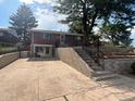 Brick exterior featuring a multi-tiered yard, steps leading to the front door, and ample parking at 25 S Winona Ct, Denver, CO 80219