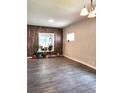 Neutral Living Room with hard surface floors and wood accent wall at 2156 Federal Blvd, Denver, CO 80211