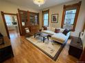 Cozy living room with hardwood floors, built-in shelving, and ample natural light, great for relaxing at 2335 Stout St, Denver, CO 80205