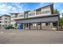 Exterior of a condo building with a carport, showcasing its modern design and convenient parking at 1304 Snowberry # 102, Louisville, CO 80027