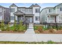 Charming townhome featuring a welcoming entrance and well-maintained landscaping at 12580 Boggs St, Parker, CO 80134