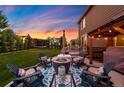 Inviting backyard with a cozy fire pit area, perfect for outdoor entertaining and relaxation at 8782 S Wenatchee Ct, Aurora, CO 80016