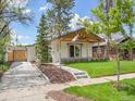 Beautifully renovated home with mature trees, new landscaping, and a private driveway at 2155 S Emerson St, Denver, CO 80210