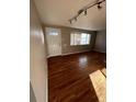 Living room with hardwood floors, neutral paint and natural light at 1245 Yates St, Denver, CO 80204