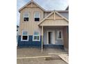 Two-story house showing the front exterior with an open door and visible construction at 15242 Detroit St, Thornton, CO 80602