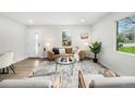 Bright living room with stylish furniture, modern decor, and ample natural light at 5491 Lowell Blvd, Denver, CO 80221