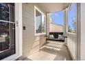 Inviting covered front porch with swing and room to enjoy outdoors at 4857 Tarcoola Ln, Highlands Ranch, CO 80130