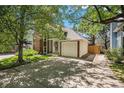 This home offers an attached garage and well-maintained lawn at 16724 E Hialeah Ave, Centennial, CO 80015