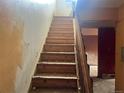 View of uncarpeted staircase leading to second level at 1413 Centennial Dr, Longmont, CO 80501