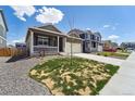 Beautiful home featuring a covered porch and a lush front yard, perfect for Gathering living at 2226 Monte Vista St, Fort Lupton, CO 80621