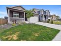 Inviting home with landscaped front yard, porch, and driveway, showcasing curb appeal at 2226 Monte Vista St, Fort Lupton, CO 80621