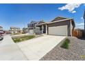 Inviting home with an attached two-car garage, complemented by a neat landscape and a welcoming front porch at 2226 Monte Vista St, Fort Lupton, CO 80621