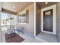 Cozy front porch with seating, offering a charming view and a welcoming entrance to the home at 2226 Monte Vista St, Fort Lupton, CO 80621