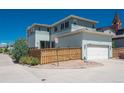 Home featuring a fenced backyard, garage, and private patio area, perfect for outdoor living at 9781 Dunning Cir, Highlands Ranch, CO 80129