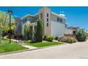 Well-maintained home with a side yard, grassy area, and mature trees enhancing its curb appeal at 9781 Dunning Cir, Highlands Ranch, CO 80129