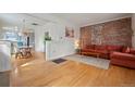 Comfortable living room with an exposed brick wall and modern seating at 421 Elati St, Denver, CO 80204