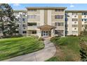 Building exterior, showing entrance and landscaping at 595 S Alton Way # 5D, Denver, CO 80247